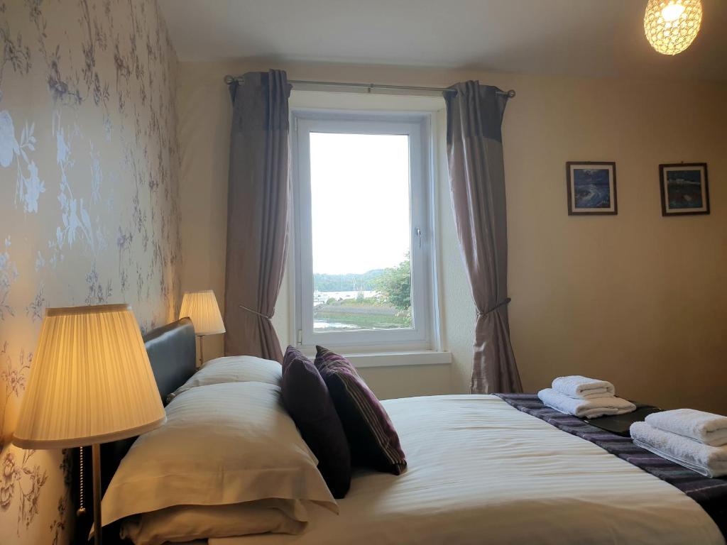 Postel nebo postele na pokoji v ubytování Carnaburg Guesthouse