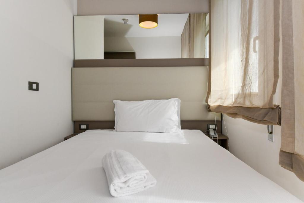Postel nebo postele na pokoji v ubytování Hotel Delle Mimose