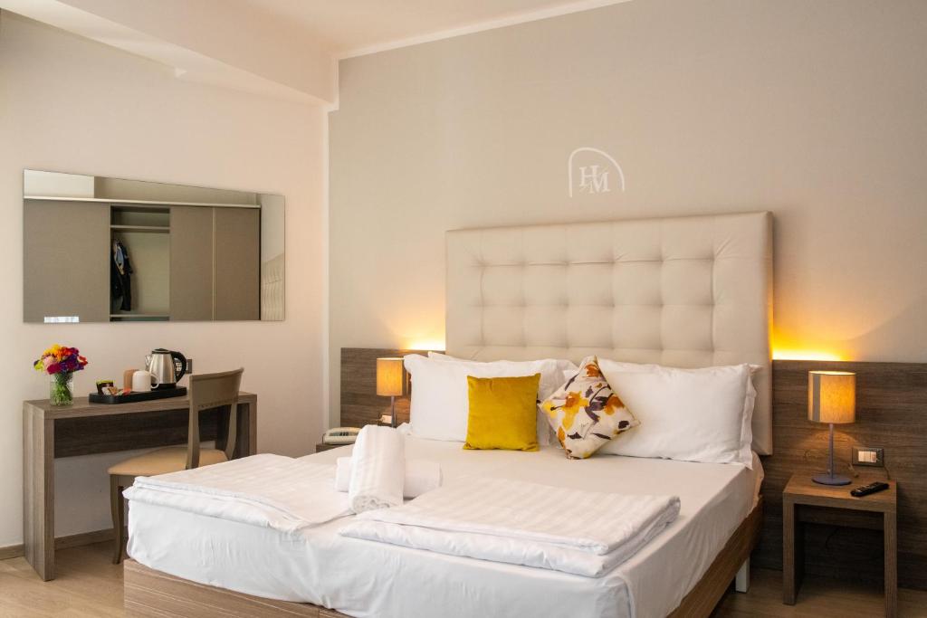 Postel nebo postele na pokoji v ubytování Hotel Delle Mimose