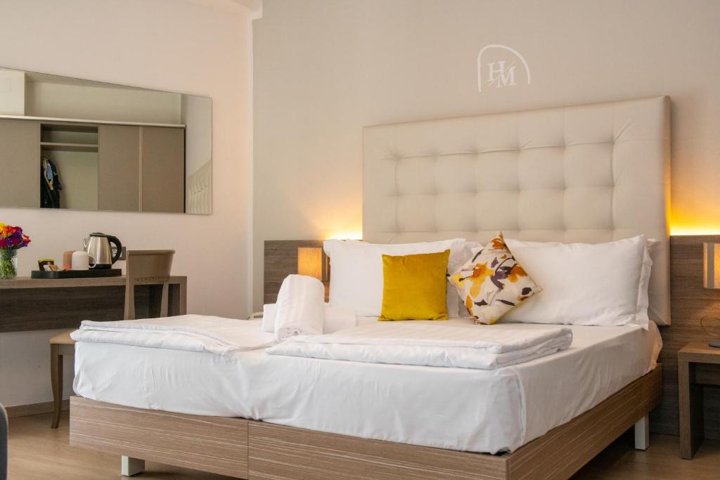 Postel nebo postele na pokoji v ubytování Hotel Delle Mimose