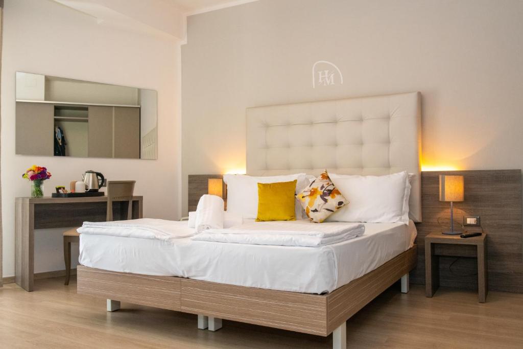 Postel nebo postele na pokoji v ubytování Hotel Delle Mimose