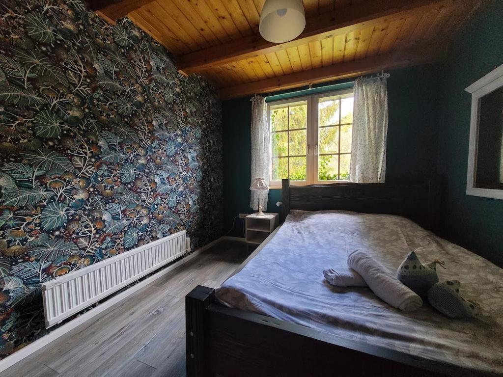 Postel nebo postele na pokoji v ubytování Willa pod Jemiołą