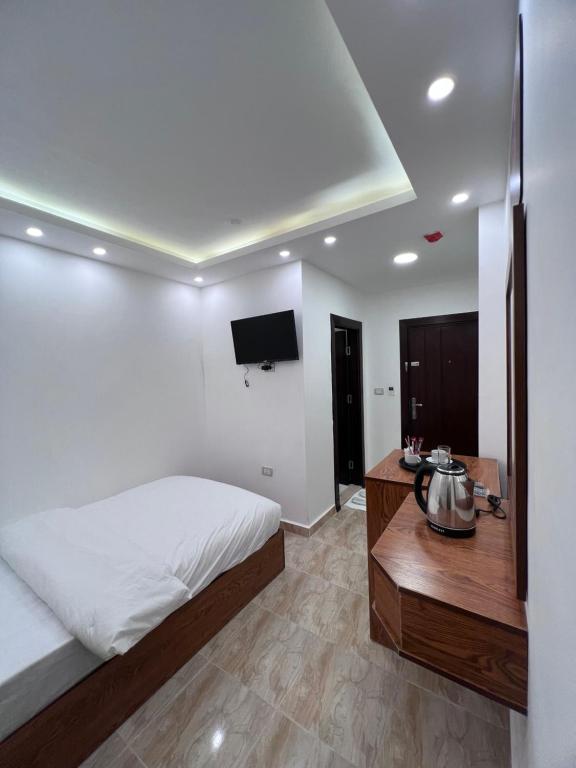Postel nebo postele na pokoji v ubytování Petra Family Hotel