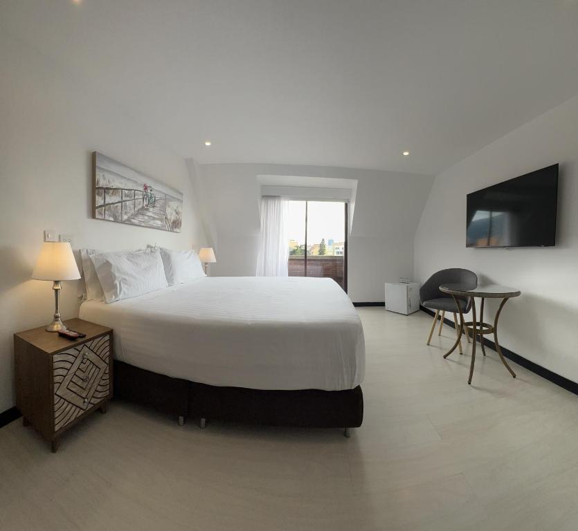 Postel nebo postele na pokoji v ubytování Suites 109 GH Usaquén