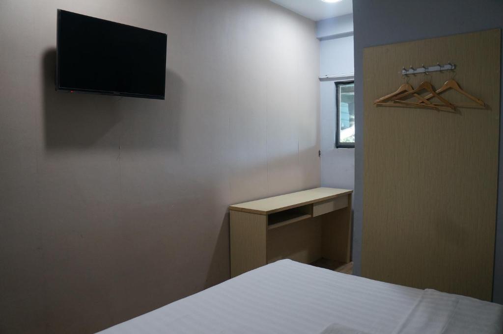 TV a/nebo společenská místnost v ubytování Unikarya Lodge
