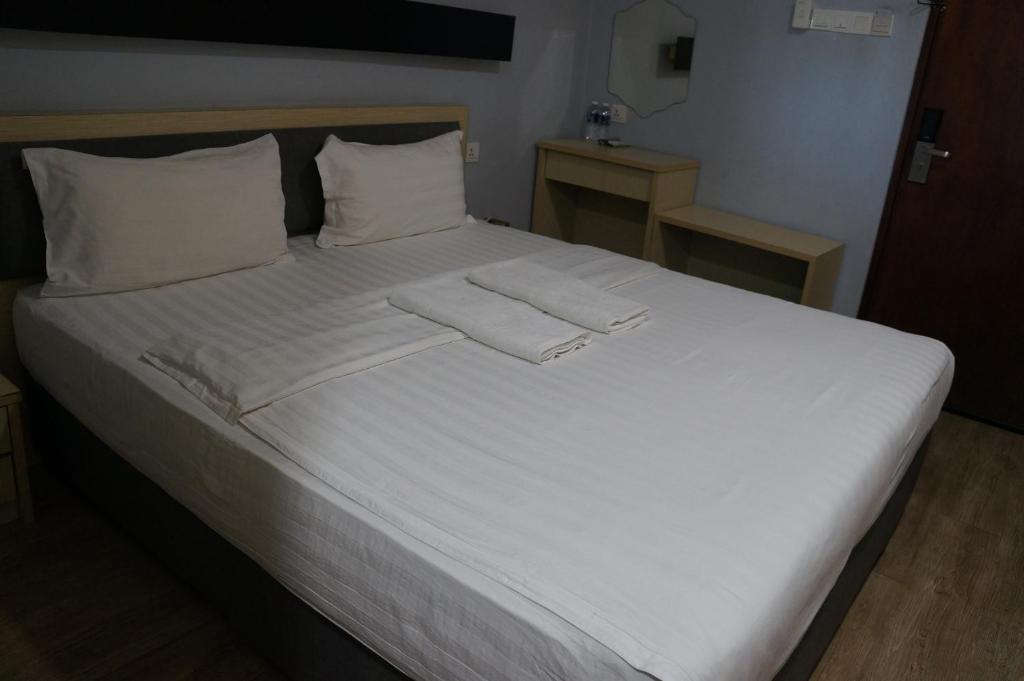 Postel nebo postele na pokoji v ubytování Unikarya Lodge