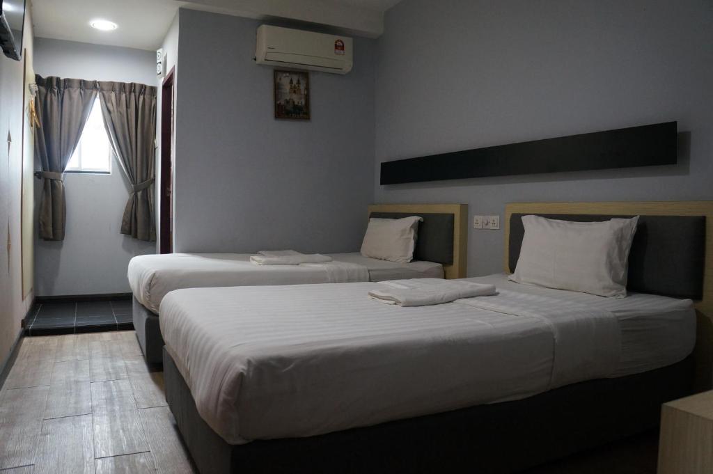 Postel nebo postele na pokoji v ubytování Unikarya Lodge