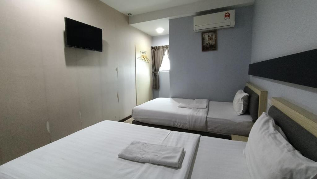 Postel nebo postele na pokoji v ubytování Unikarya Lodge