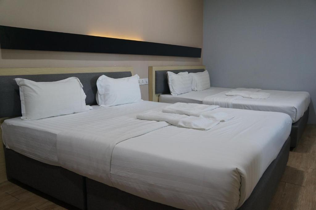 Postel nebo postele na pokoji v ubytování Unikarya Lodge