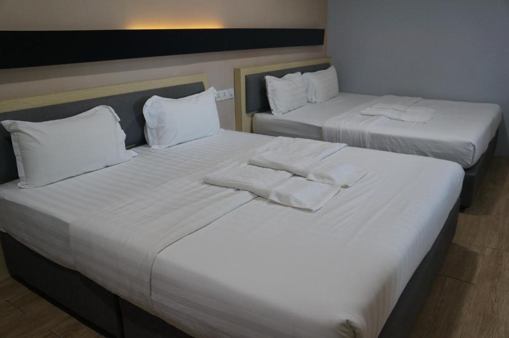Postel nebo postele na pokoji v ubytování Unikarya Lodge