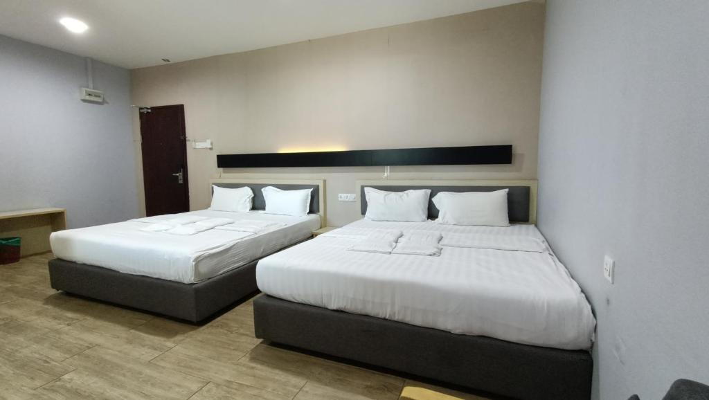 Postel nebo postele na pokoji v ubytování Unikarya Lodge