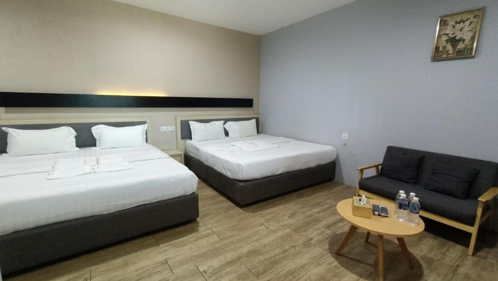 Postel nebo postele na pokoji v ubytování Unikarya Lodge