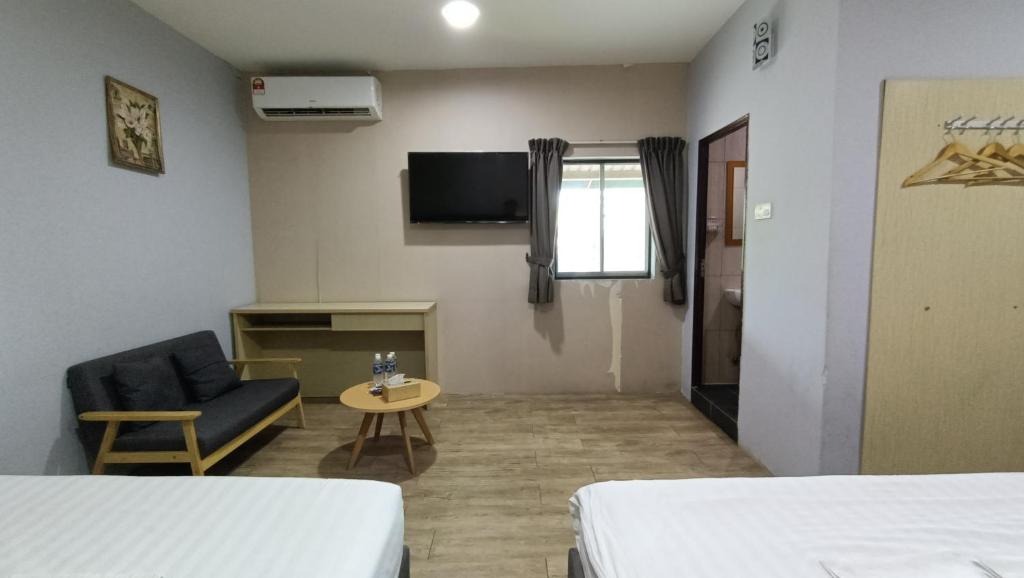Postel nebo postele na pokoji v ubytování Unikarya Lodge