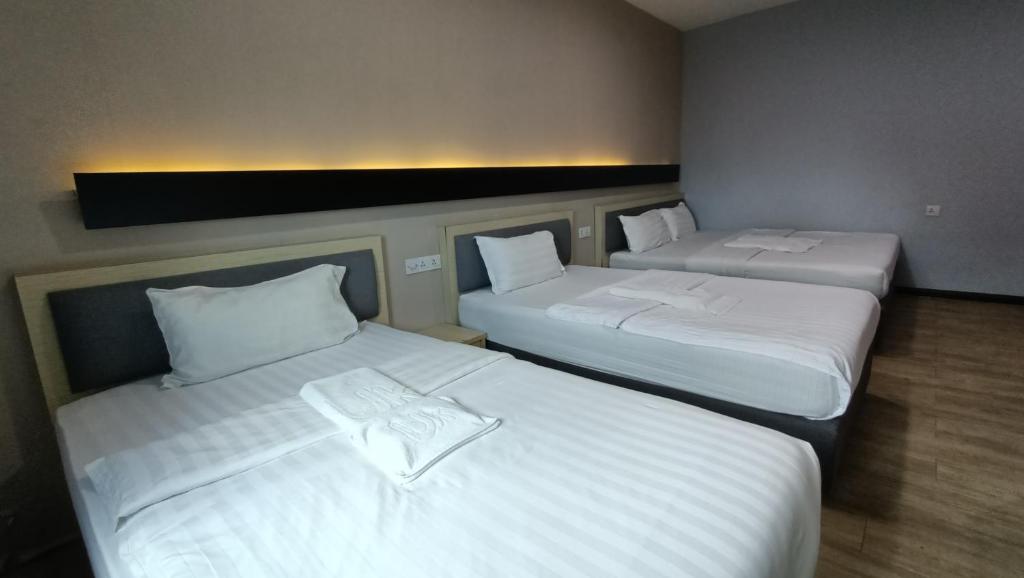 Postel nebo postele na pokoji v ubytování Unikarya Lodge