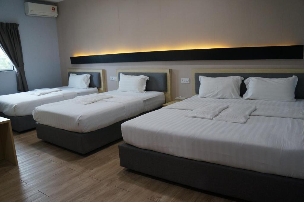 Postel nebo postele na pokoji v ubytování Unikarya Lodge