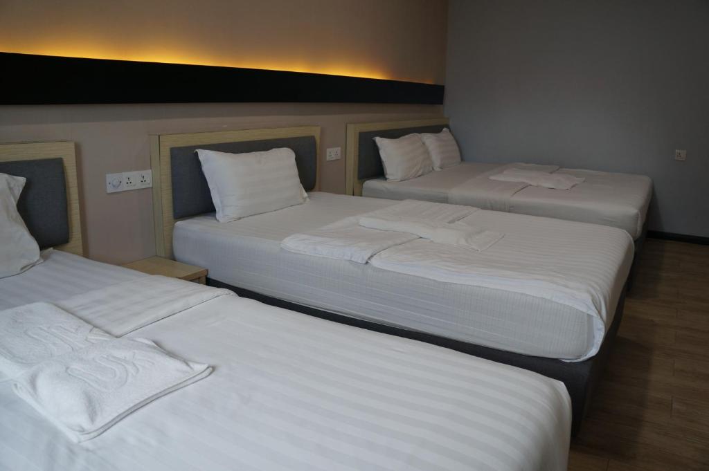 Postel nebo postele na pokoji v ubytování Unikarya Lodge