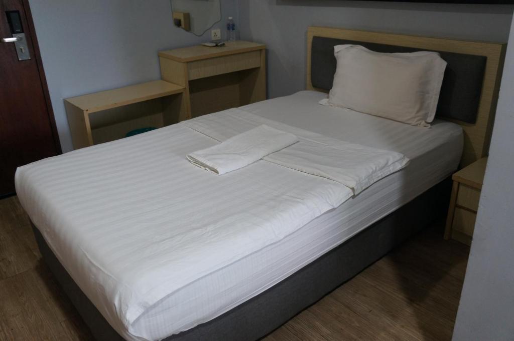 Postel nebo postele na pokoji v ubytování Unikarya Lodge
