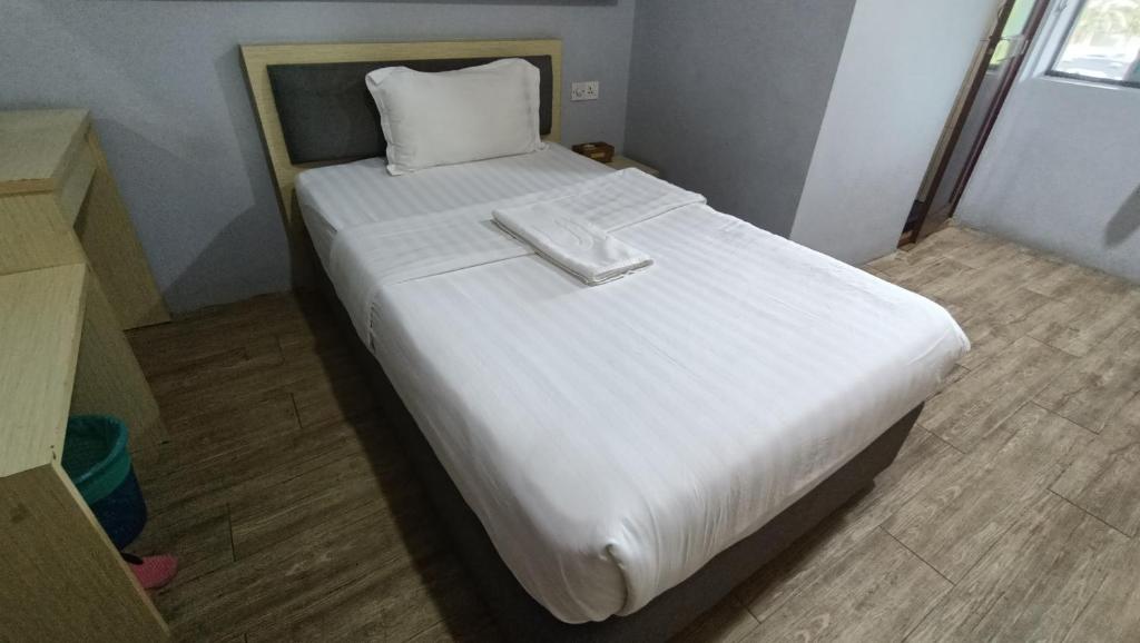 Postel nebo postele na pokoji v ubytování Unikarya Lodge