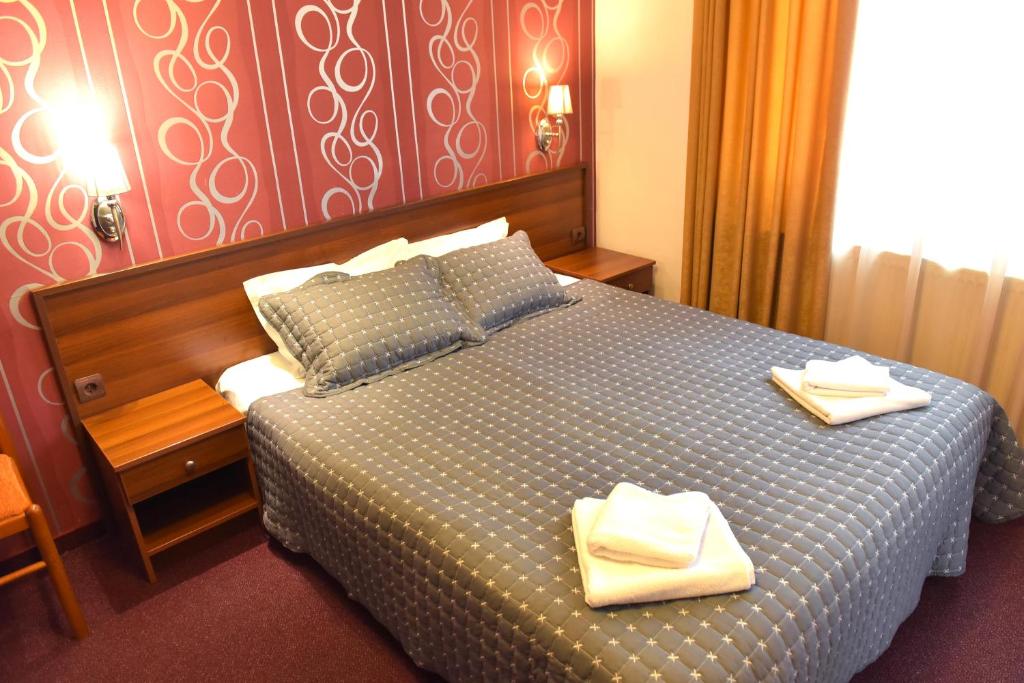 Postel nebo postele na pokoji v ubytování Hotel Rothmans-Breakfast - Free parking - Lobby