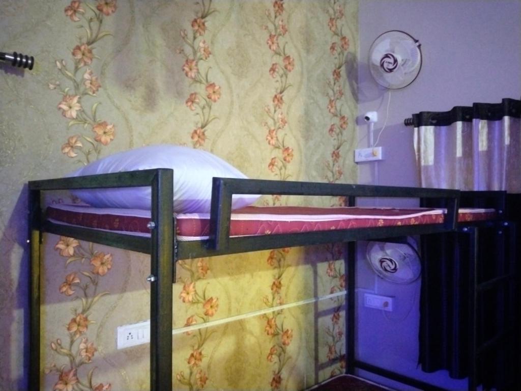 Voodi või voodid majutusasutuse UTKARSH HOTEL toas