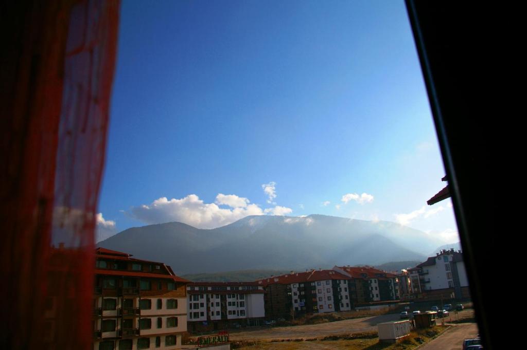 a view from a window of a city with a mountain at Nevena Apartments in Bansko