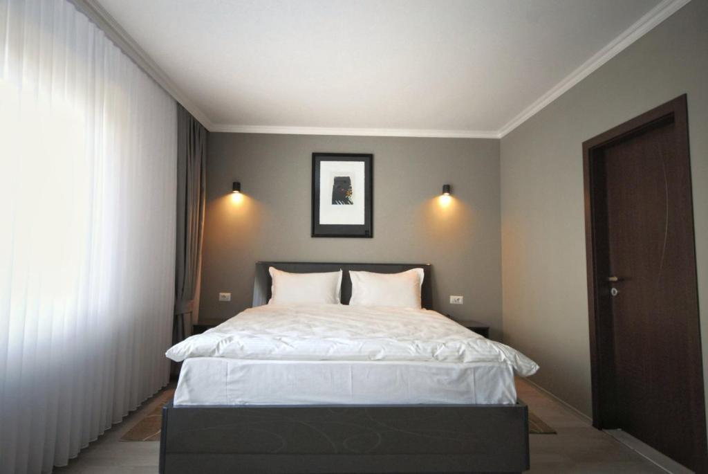 Postel nebo postele na pokoji v ubytování Hotel Callisto