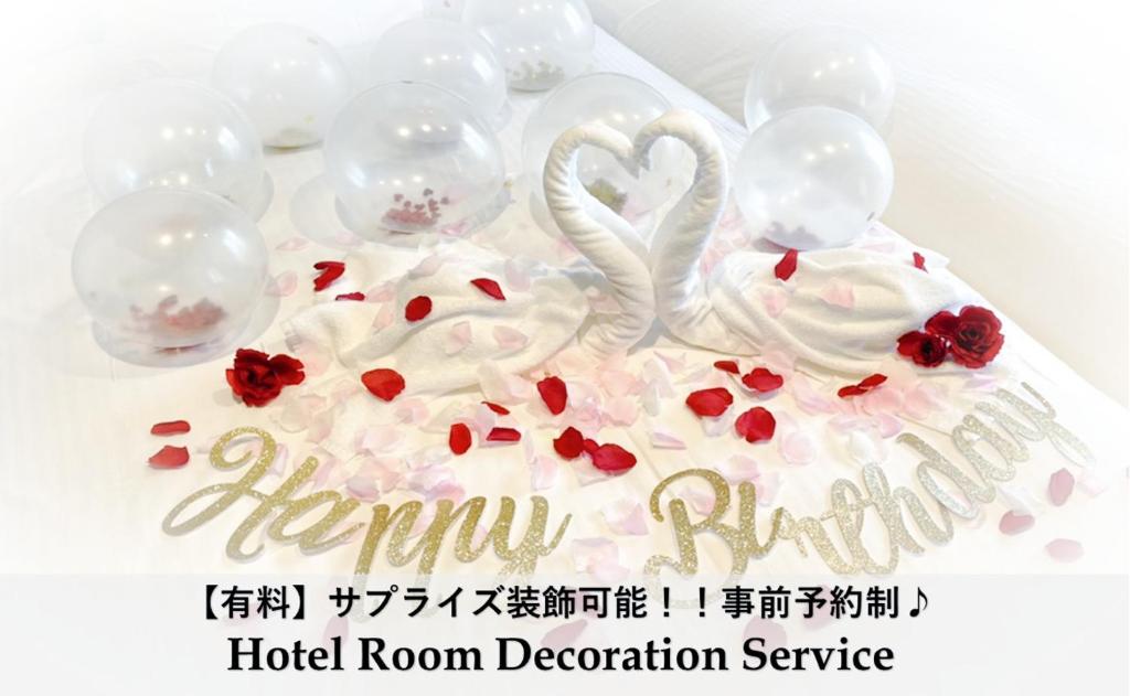 a cake with a swan made out of whipped cream at LUXCARE HOTEL in Osaka