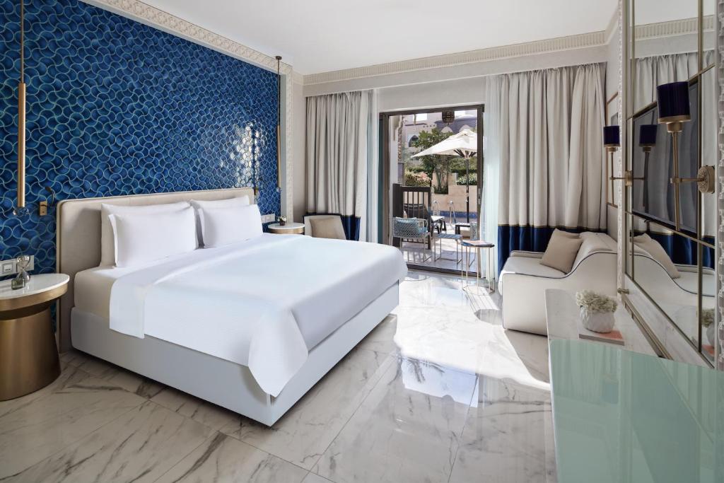 Postel nebo postele na pokoji v ubytování Rixos Premium Saadiyat Island - All Inclusive