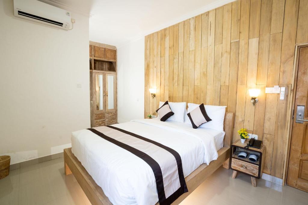 Postel nebo postele na pokoji v ubytování Oki Taru Residence