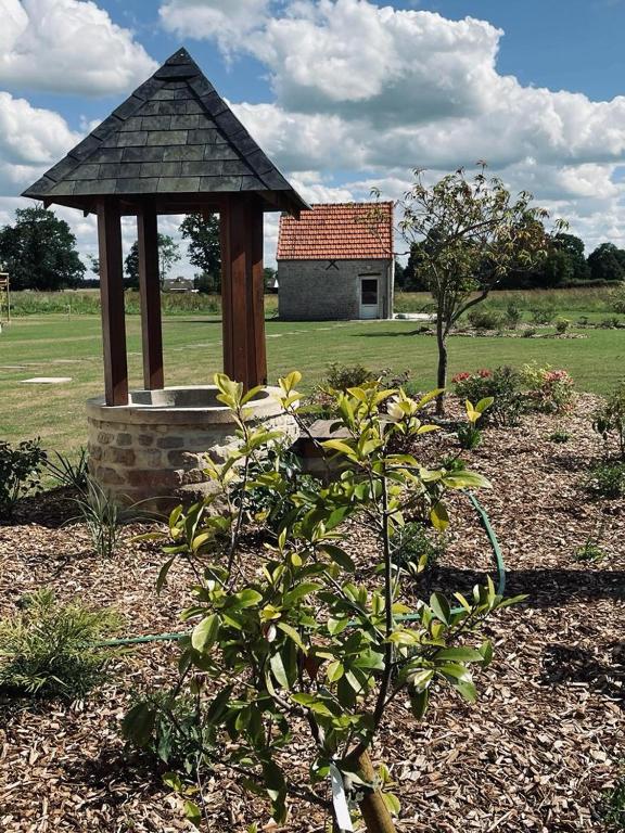 a garden with a gazebo in the middle of a field at Aurefees in Ellon