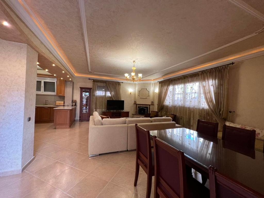 a living room with a couch and a table at SOFIA APARTMENTS in Thessaloniki