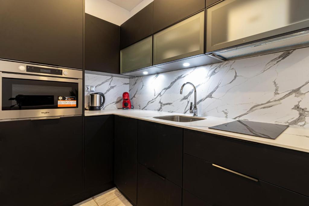 Kuchyňa alebo kuchynka v ubytovaní Allo Apartments San Roque Bajo A