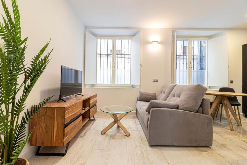Televízia a/alebo spoločenská miestnosť v ubytovaní Allo Apartments San Roque Bajo A