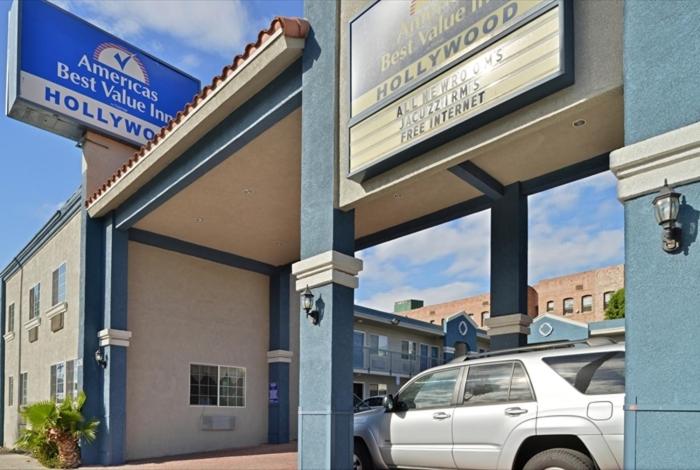 a car parked in front of a hotel at Americas Best Value Inn Hollywood in Los Angeles