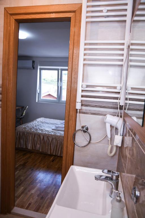 Postel nebo postele na pokoji v ubytování Demir Apartmani