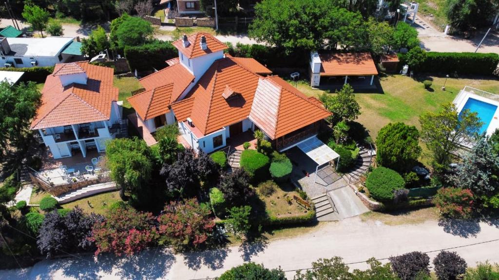 an overhead view of a house with an orange roof at Cabañas Las Pencas in Mina Clavero