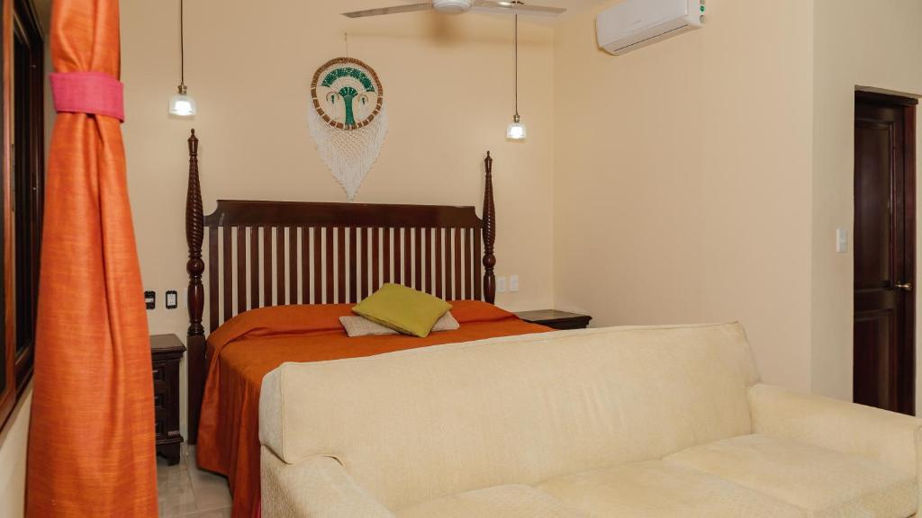 Postel nebo postele na pokoji v ubytování Hotel Nojoch che