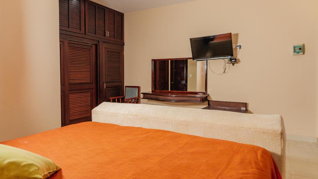 Postel nebo postele na pokoji v ubytování Hotel Nojoch che