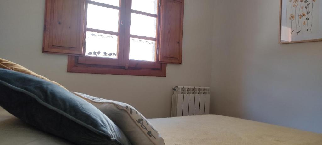 Łóżko lub łóżka w pokoju w obiekcie Casa termas de Arnedillo