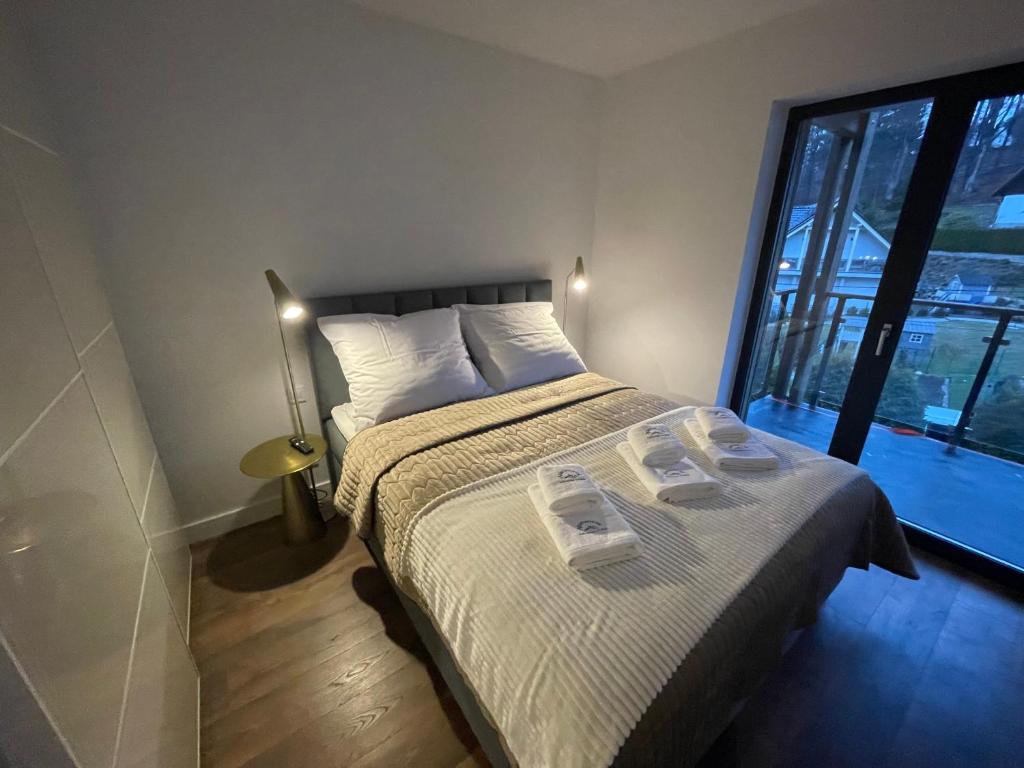 Posteľ alebo postele v izbe v ubytovaní Apartament Szklarski Widok