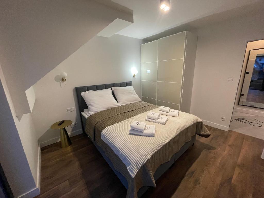 Posteľ alebo postele v izbe v ubytovaní Apartament Szklarski Widok