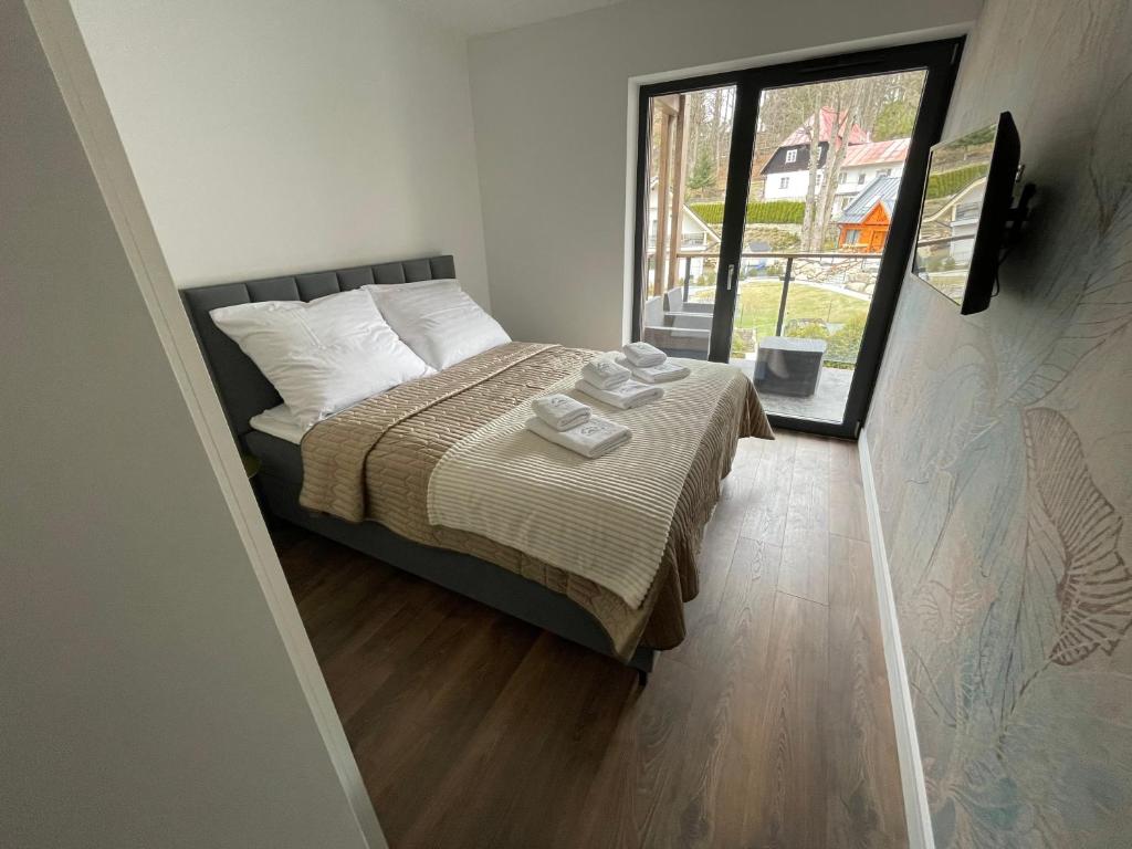 Posteľ alebo postele v izbe v ubytovaní Apartament Szklarski Widok