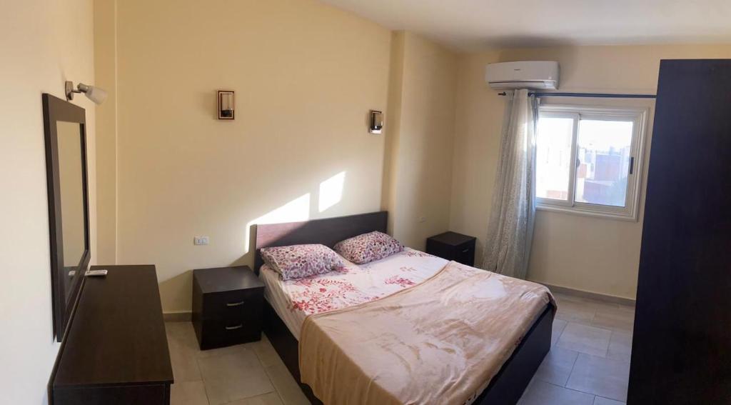 A bed or beds in a room at Bahga Palace 4 Residential Apartments