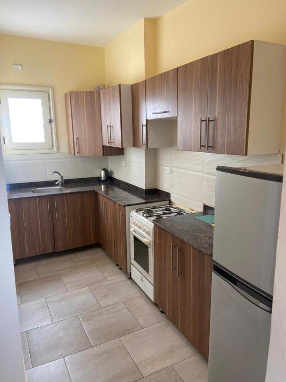 A kitchen or kitchenette at Bahga Palace 4 Residential Apartments