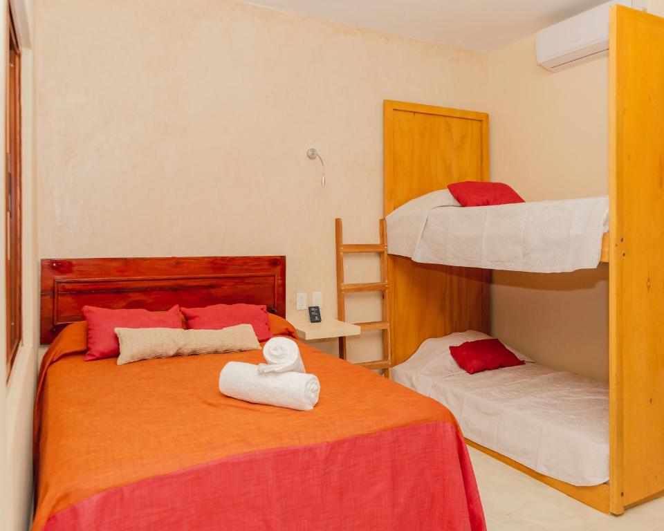 Postel nebo postele na pokoji v ubytování Hotel Nojoch che