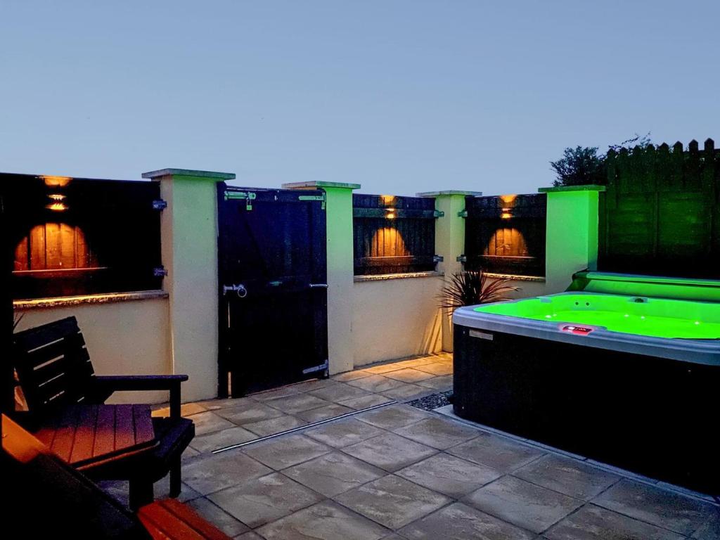 a patio with a pool table and a pool table at Nant Aeron in Talsarn