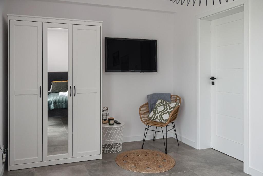 TV a/nebo společenská místnost v ubytování Apartamenty Osada Antałówka Zakopane