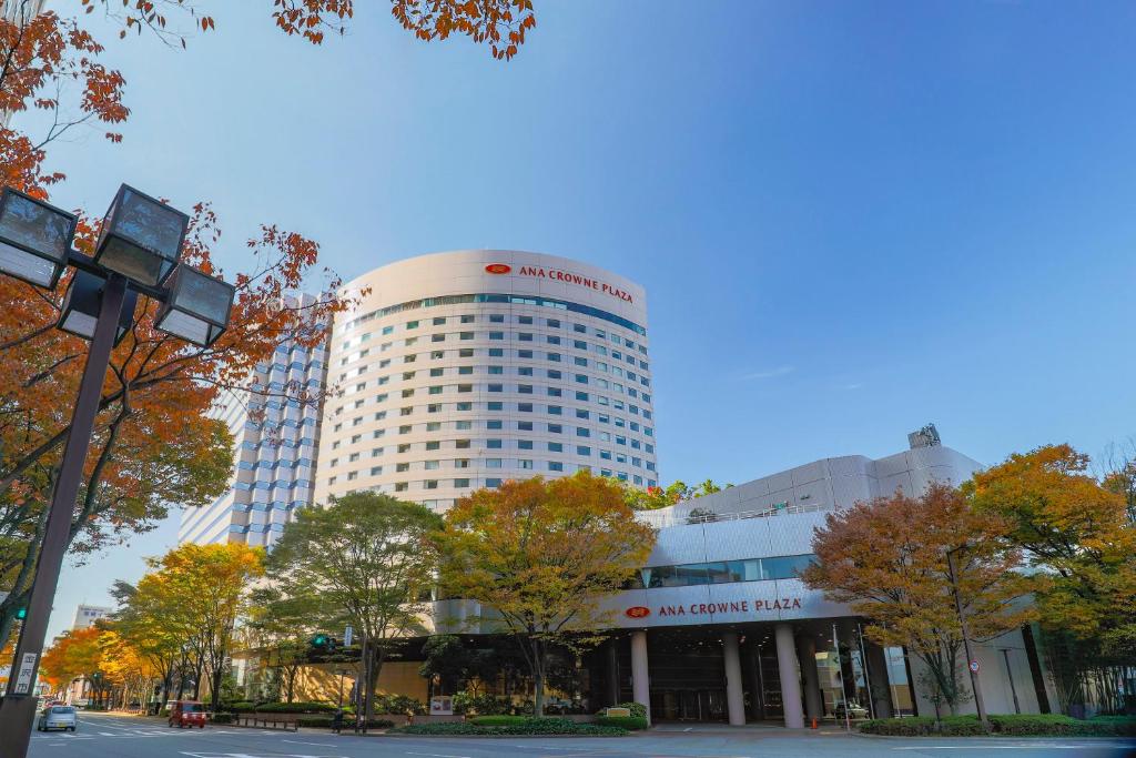 a building with a sign on the top of it at ANA Crowne Plaza Kanazawa, an IHG Hotel in Kanazawa