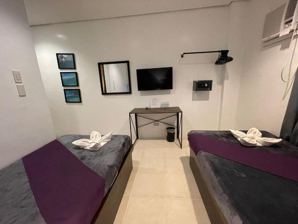 Postel nebo postele na pokoji v ubytování Coron Ecolodge