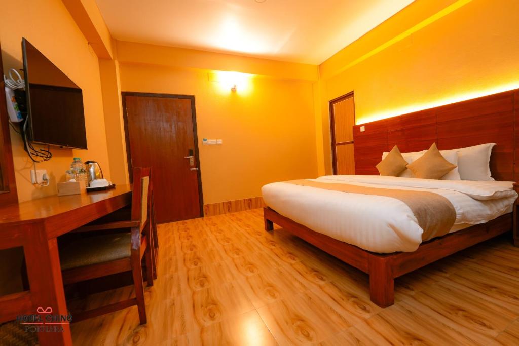 Llit o llits en una habitació de Hotel Chino Pokhara